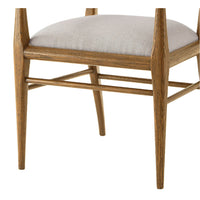 Detailed view of chair leg and seat fabric.