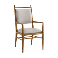 Oak dining armchair angled view, upholstered seat.
