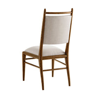 Back view of oak dining chair with upholstery.