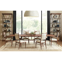 Dining room setup with mid-century oak dining chairs.
