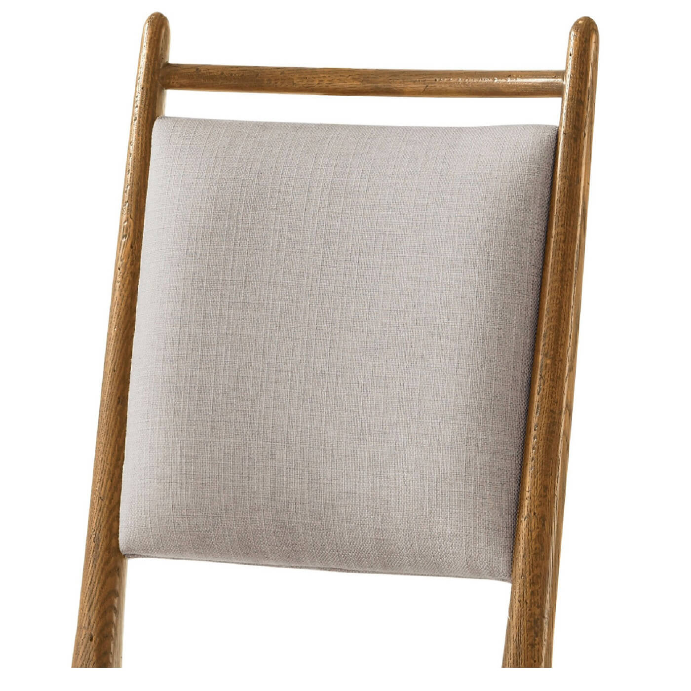 Close-up of oak chair backrest.