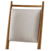 Close-up of oak chair backrest.