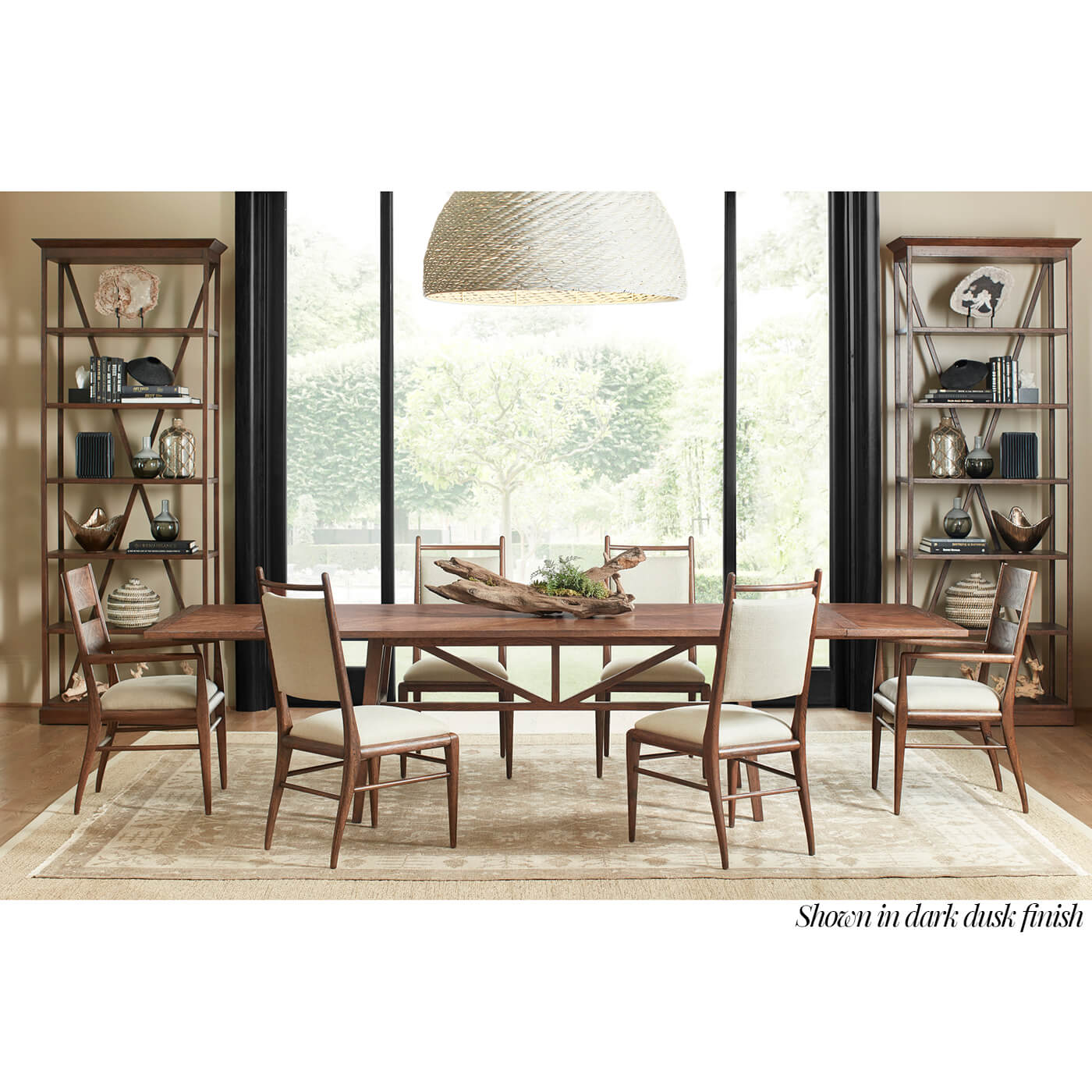 Dining set with mid-century oak chairs in room.