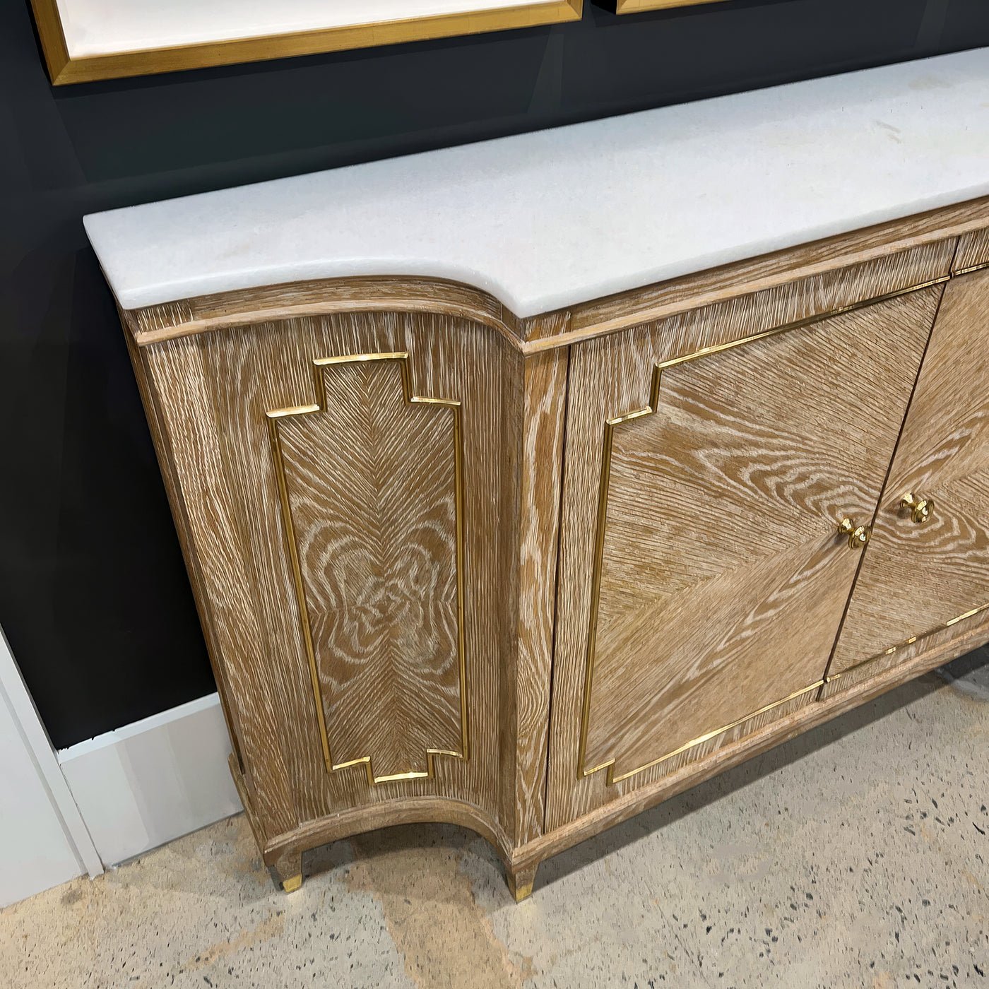 Side view of Mid Century oak sideboard, detailed paneling.
