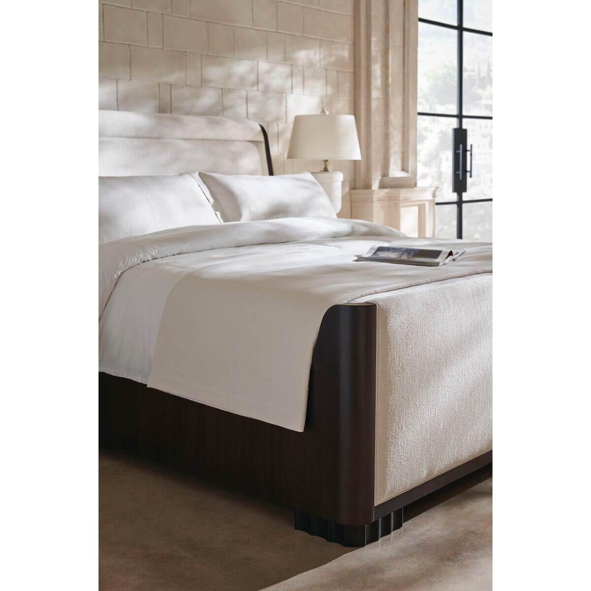 Close-up of bedding on mid-century queen sleigh bed.