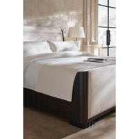 Close-up of bedding on mid-century queen sleigh bed.