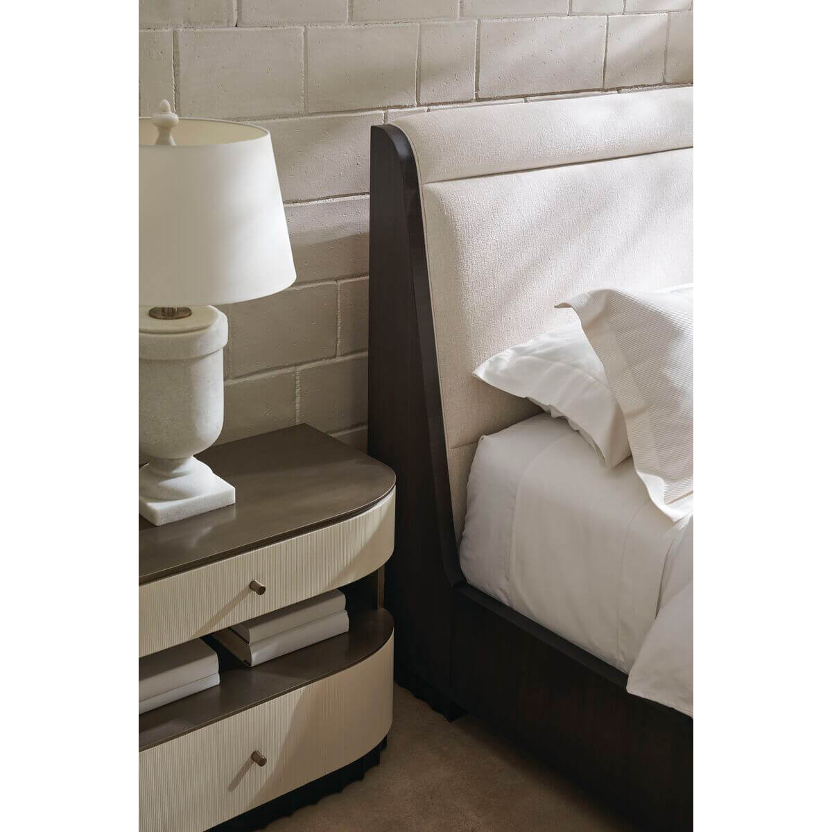 Headboard detail of mid-century queen sleigh bed and table.