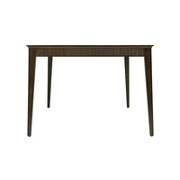 End view of mid-century dining table, tapered legs.