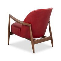 Rear angle red leather armchair mid-century wood legs.