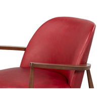 Seat and backrest red leather armchair mid-century design.