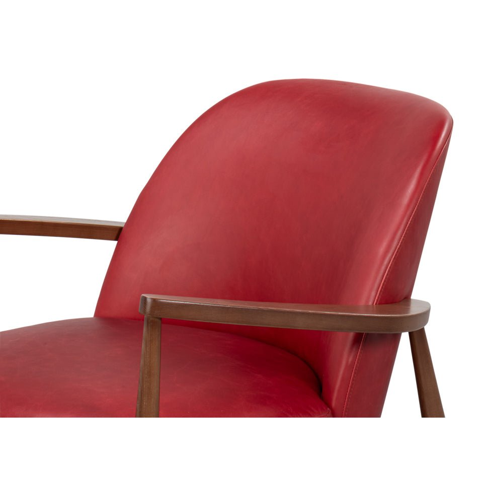 Seat and backrest red leather armchair mid-century design.