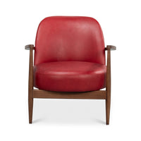 Front close-up red leather armchair mid-century wood arms.