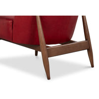 Leg and frame detail red leather armchair mid-century.