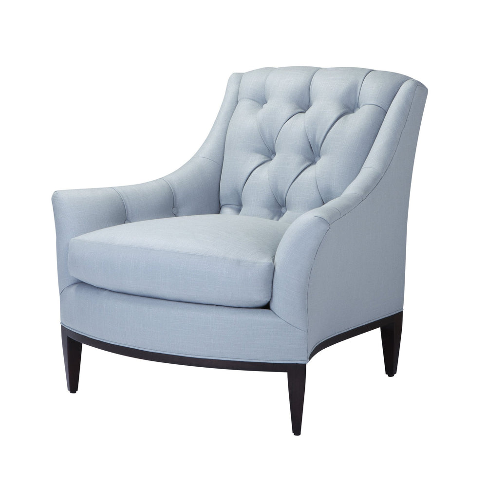 Light blue tufted armchair in angled view.