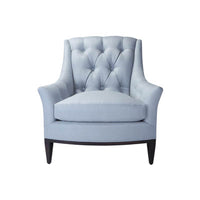 Front view of light blue tufted armchair.