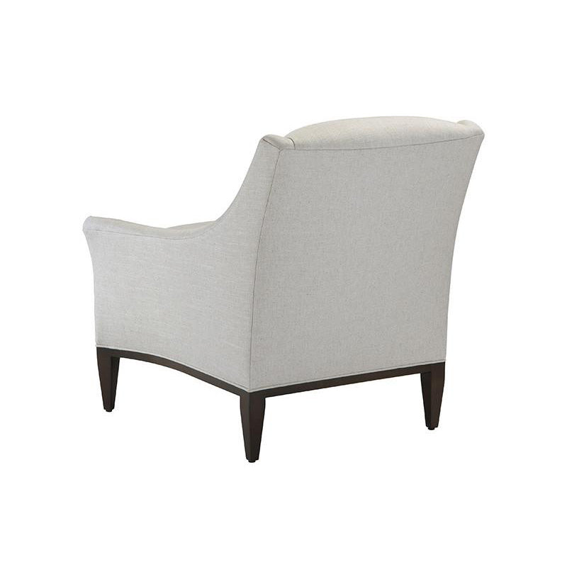 Beige fabric armchair rear view sophisticated look.