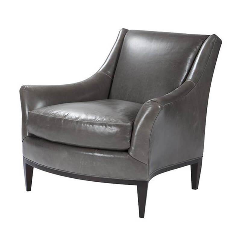 Gray leather armchair angled view mid-century design.
