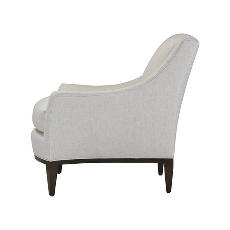 Beige fabric armchair side view elegant silhouette.
