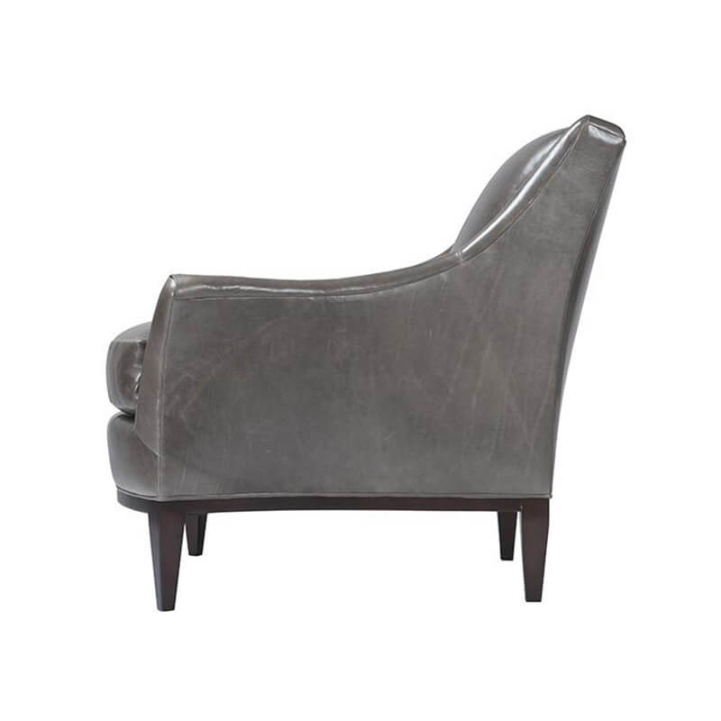 Gray leather armchair side view sleek profile.