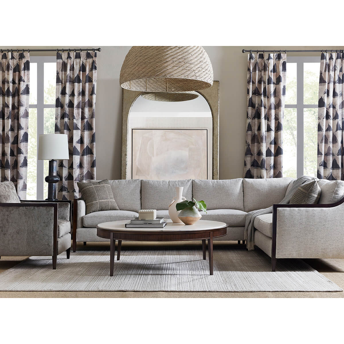 Round cocktail table in modern living room setting.