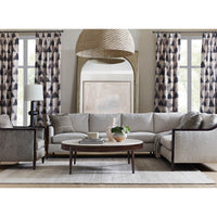 Round cocktail table in modern living room setting.