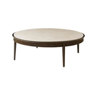 Round cocktail table with marble top, angled view.
