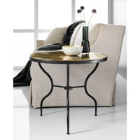 Side table beside sofa with decorative items.