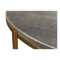 Round leather cocktail table, close-up corner, fine details.