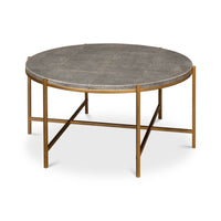 Round leather cocktail table, angled view, metal frame.