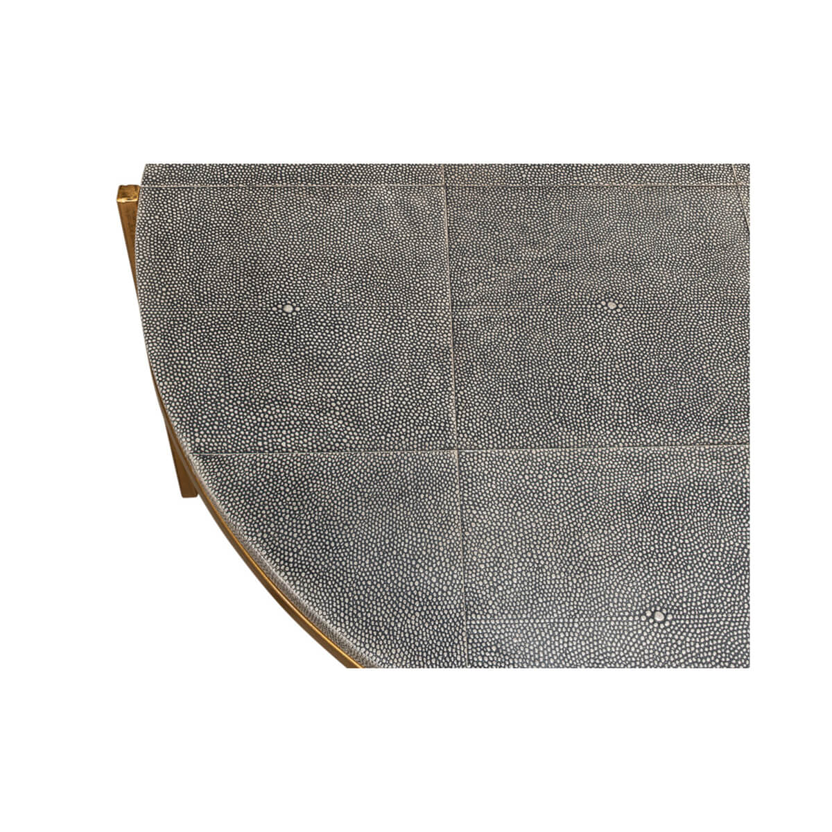 Round leather cocktail table, edge detail, patterned surface.