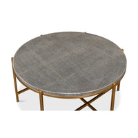 Round leather cocktail table, top-down view, textured surface.