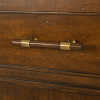Close-up of mid century sideboard drawer handle.