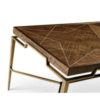 Angled view, coffee table's intricate wood and brass design.