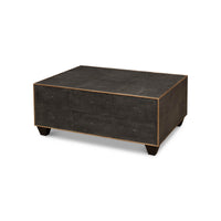 Angled view of mid-century style leather cocktail table.