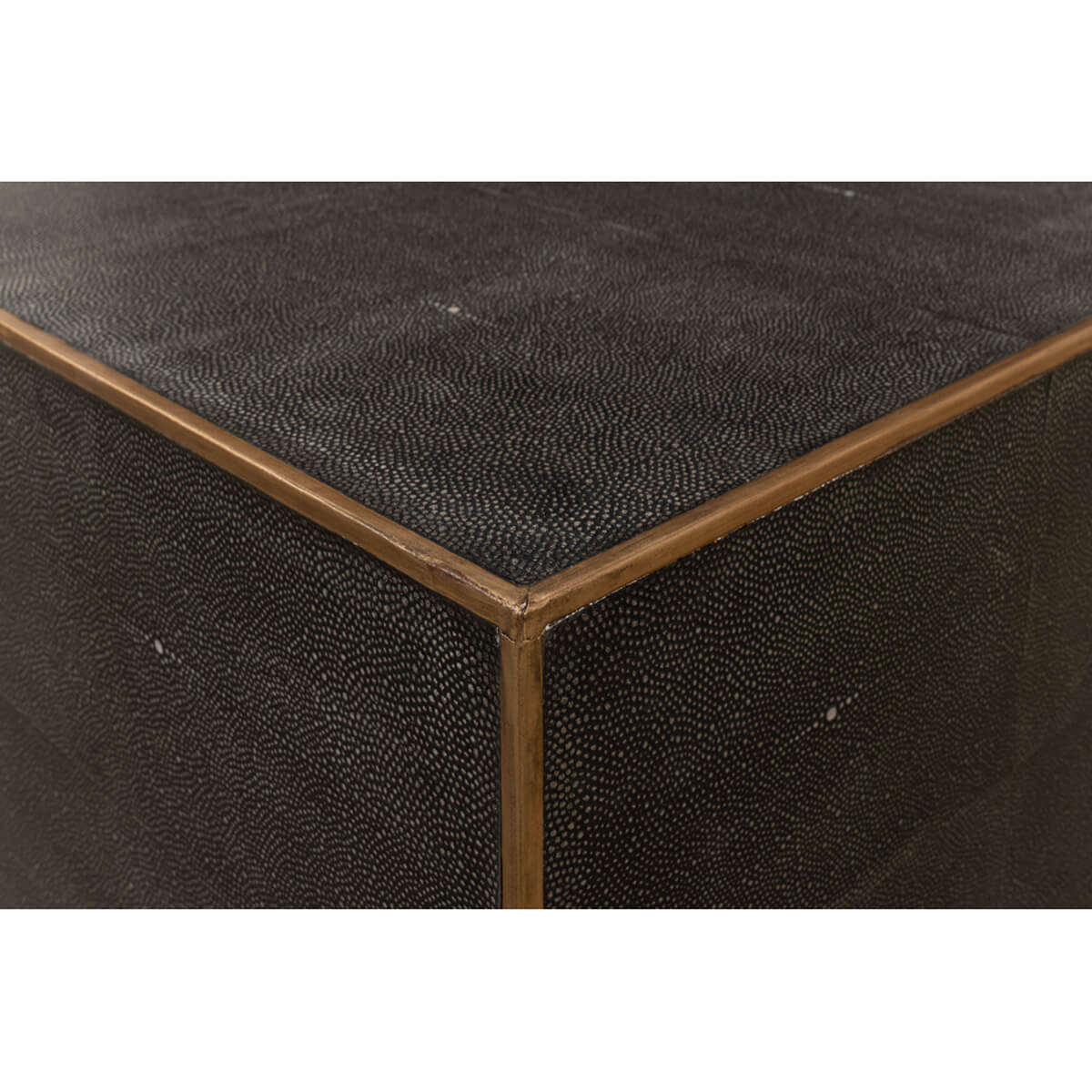 Close-up corner of mid-century style leather cocktail table.