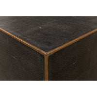 Close-up corner of mid-century style leather cocktail table.