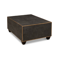 Angled side view of mid-century style leather cocktail table.
