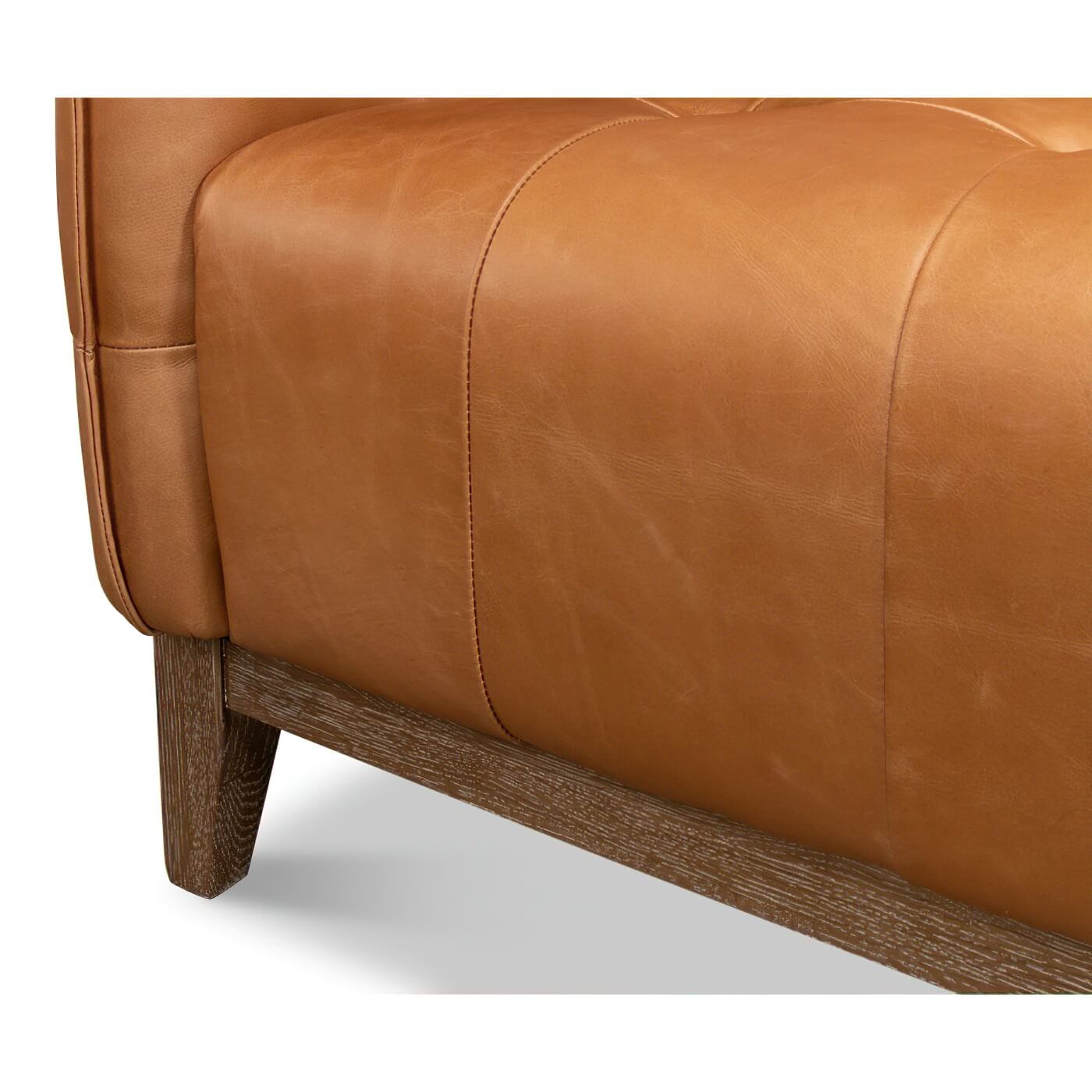 Leg and lower side detail of mid-century leather sofa.