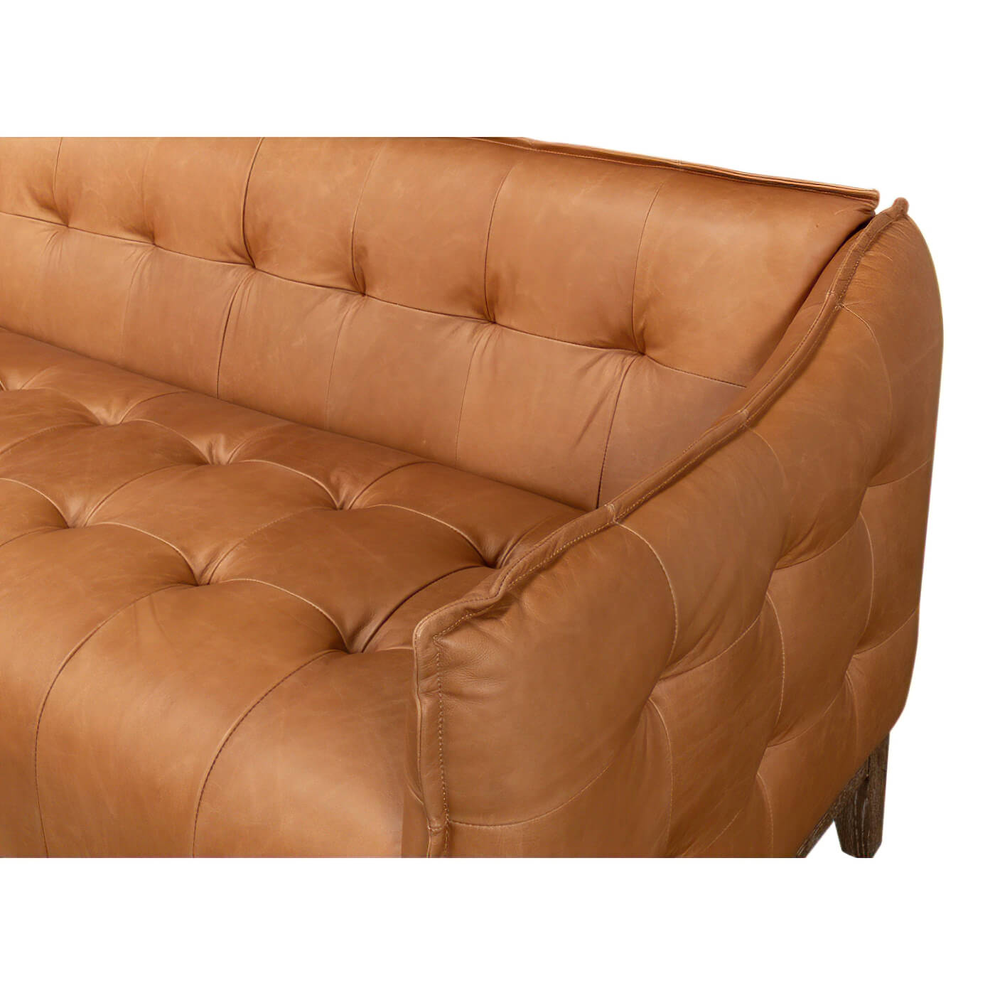 Close-up of mid-century leather sofa arm.