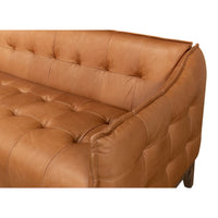 Close-up of mid-century leather sofa arm.