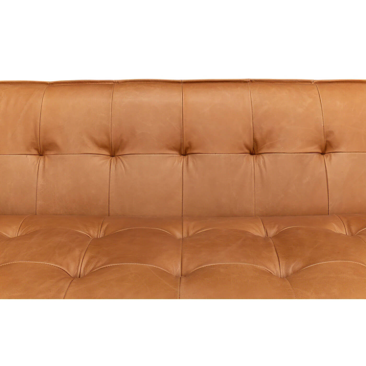 Backrest tufting detail of mid-century leather sofa.