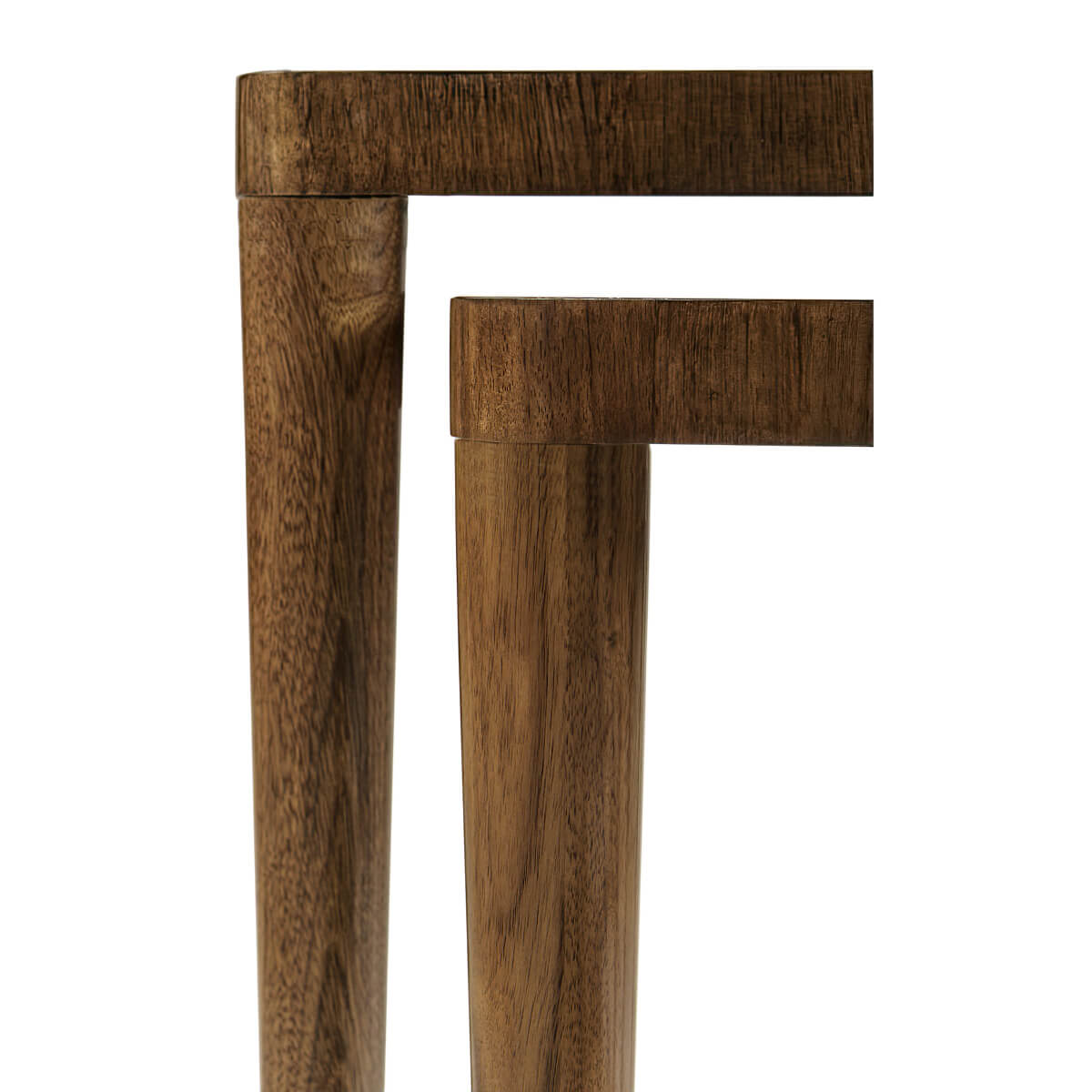 Close-up of table legs, smooth wooden finish.