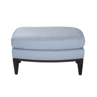 Front view of mid-century ottoman, light blue fabric