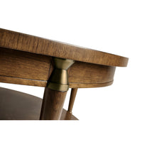 Close-up of table leg and brass accent.