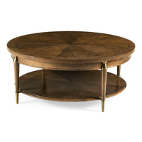 Round wooden coffee table with two tiers.