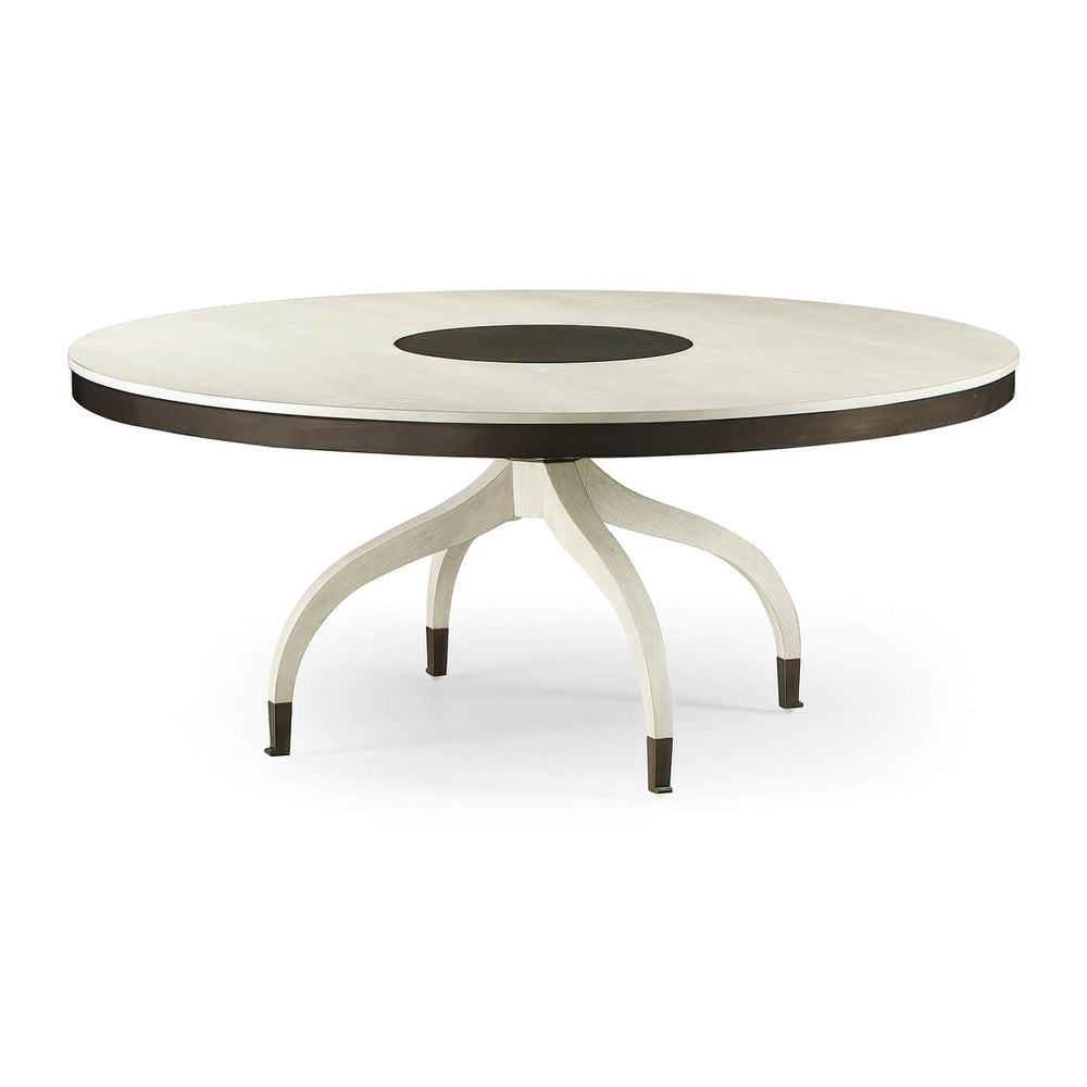 Mid-century round dining table, angled view.