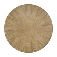 Top view of round dining table, patterned wood design.