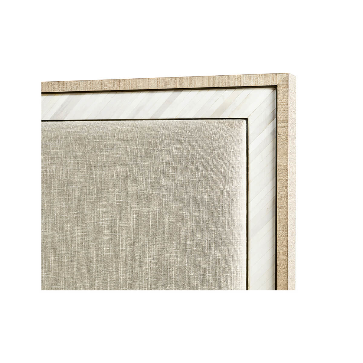 Close-up of king bed headboard, fabric and frame detail.
