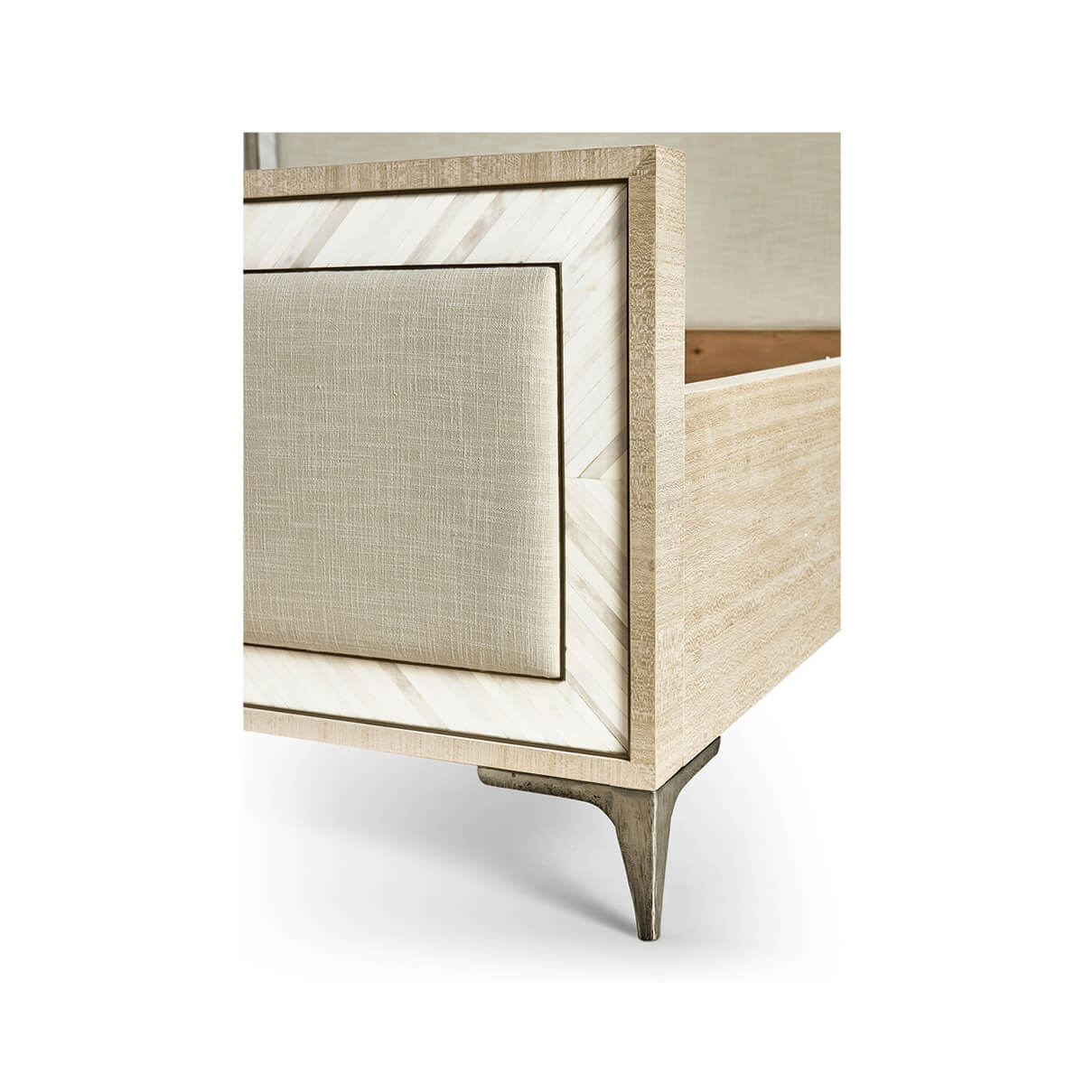 Detail of king bed footboard, decorative frame and leg.