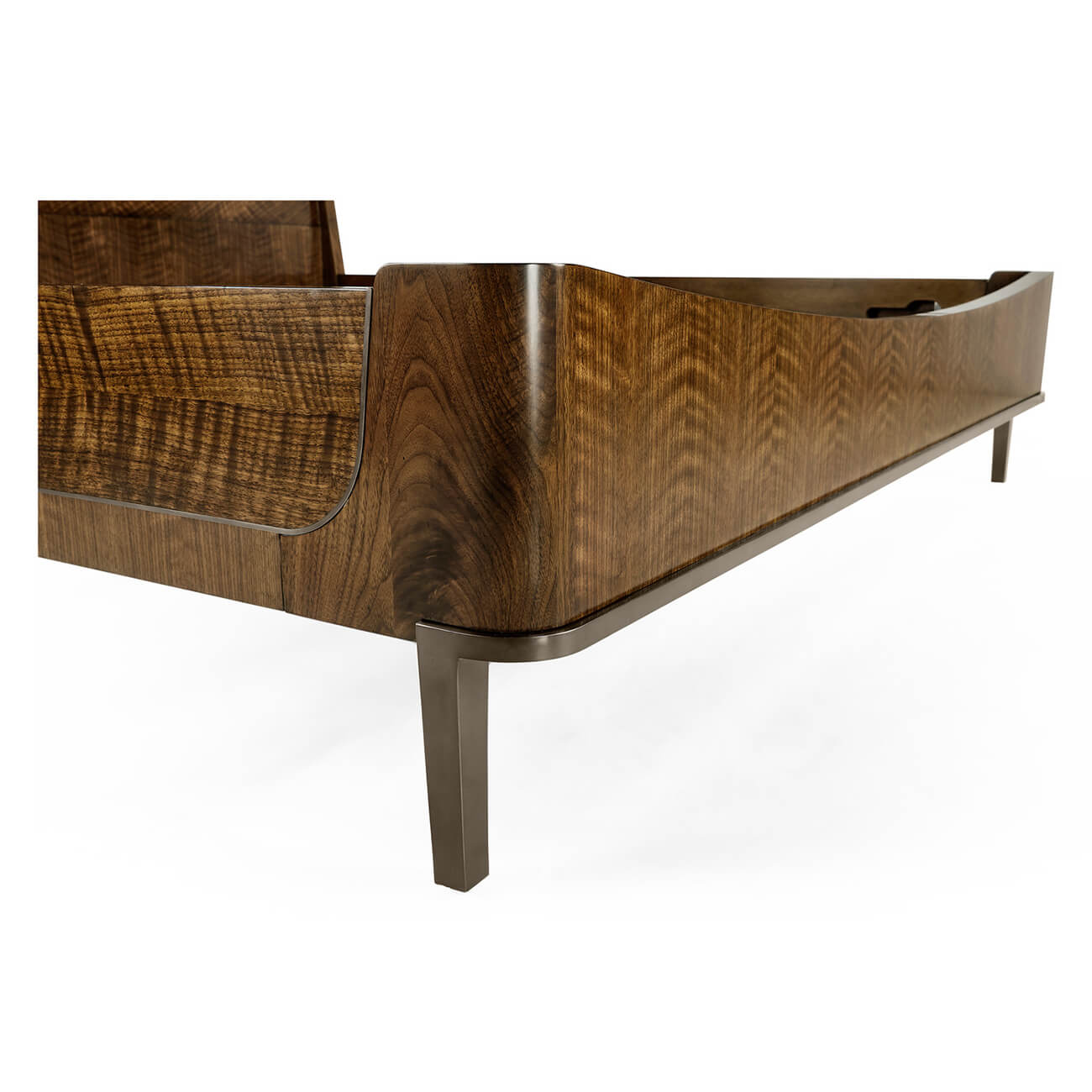Close-up of mid-century walnut bed frame and leg detail.